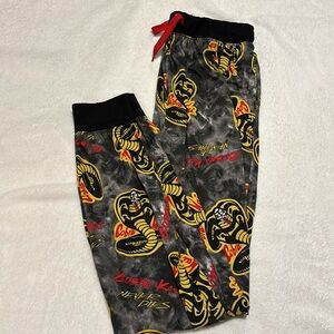 Men’s Cobra Kai Never dies pajama pants with waiste tie! King cobras.